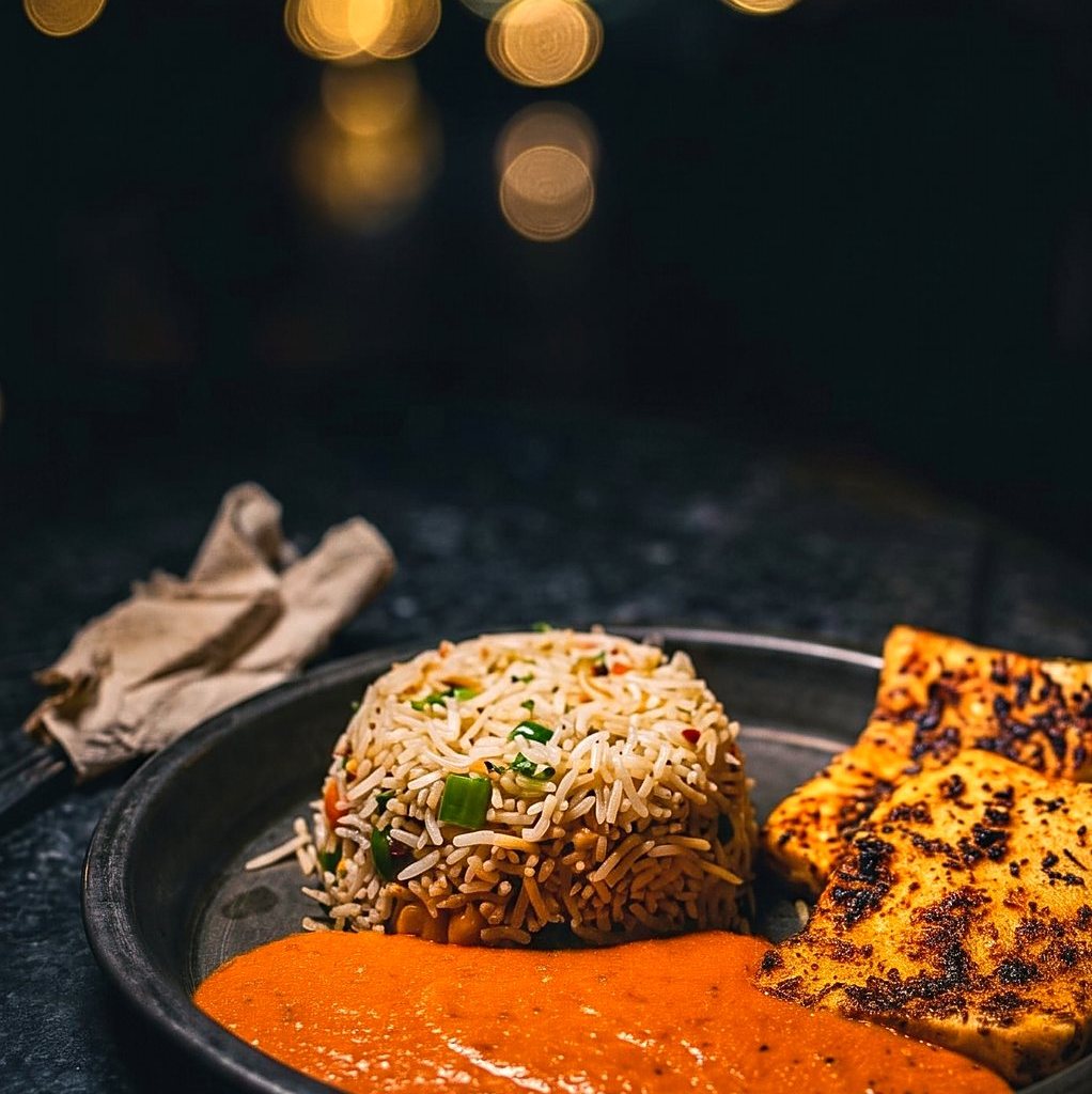 Paneer steak with herbed rice and makhani sauce