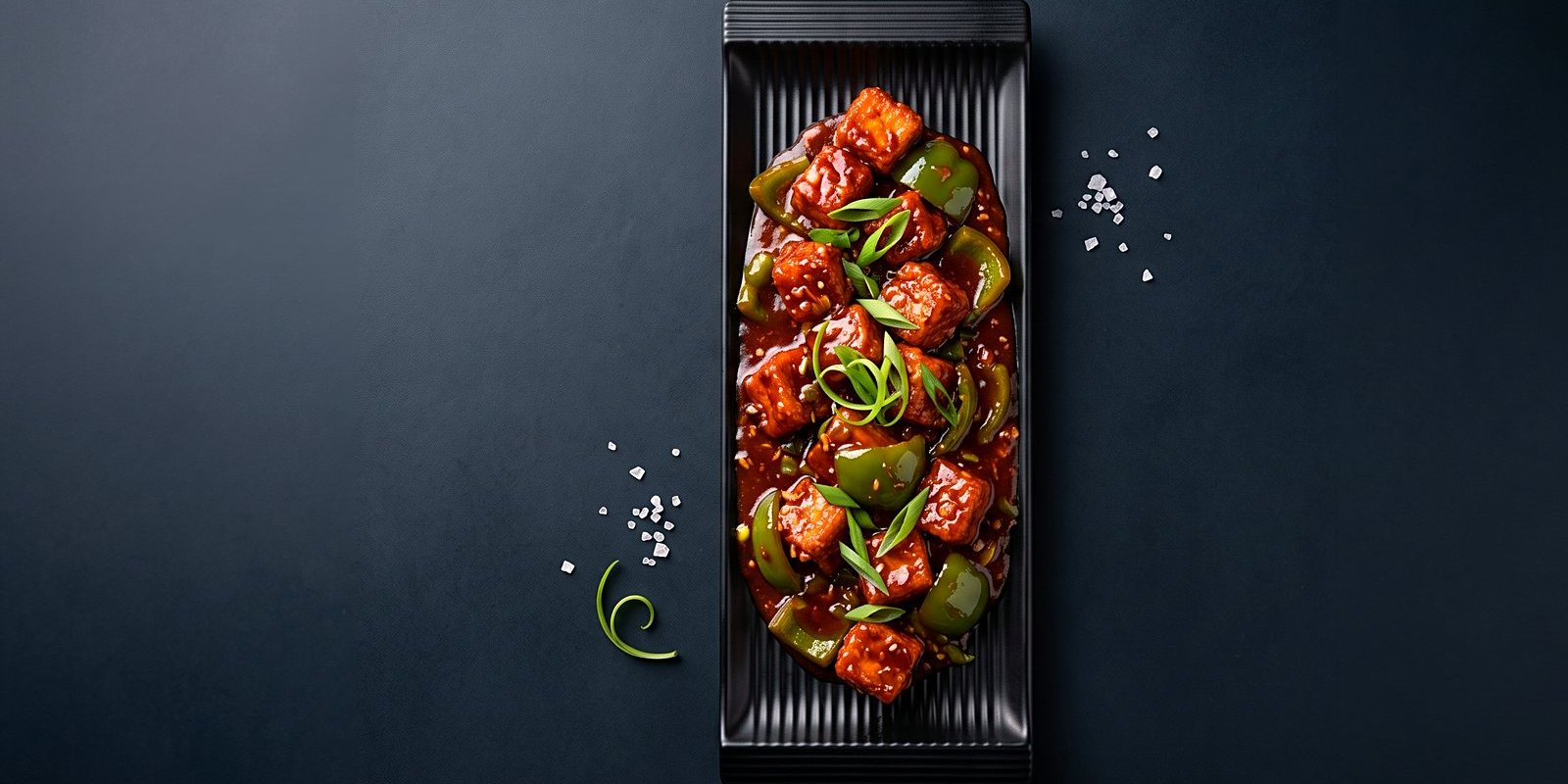 Chilli paneer with peppers and spring onion