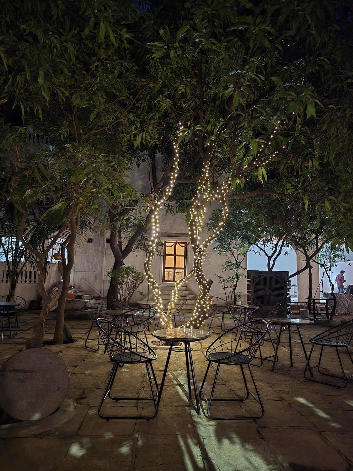 String-lit courtyard at Cafe Deja Vu